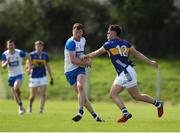 7 April 2024; Michael Curry of Waterford in action against Peter McGarry of Tipperary during the Munster GAA Football Senior Championship quarter-final match between Waterford and Tipperary at Fraher Field in Dungarvan, Waterford. Photo by Michael P Ryan/Sportsfile