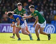 7 April 2024; Cathal McCabe of Longford is tackled by Meath players Harry O'Higgins, left, and Seán Coffey during the Leinster GAA Football Senior Championship Round 1 match between Longford and Meath at Glennon Brothers Pearse Park in Longford. Photo by Ray McManus/Sportsfile