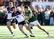 7 April 2024; Tommy Conroy of Mayo in action against Shane Brosnan, right, and Tadhg O'Riordan of New York during the Connacht GAA Football Senior Championship quarter-final match between New York and Mayo at Gaelic Park in New York, USA. Photo by Sam Barnes/Sportsfile