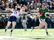 7 April 2024; Matthew Ruane of Mayo in action against Frank O'Reilly of New York during the Connacht GAA Football Senior Championship quarter-final match between New York and Mayo at Gaelic Park in New York, USA. Photo by Sam Barnes/Sportsfile
