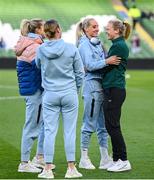 9 April 2024; Diane Caldwell of Republic of Ireland, right, with England players, from left, Alessia Russo, Mary Earps and Millie Turner before the UEFA Women's European Championship qualifying group A match between Republic of Ireland and England at Aviva Stadium in Dublin. Photo by Stephen McCarthy/Sportsfile