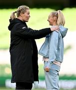9 April 2024; Republic of Ireland assistant coach Emma Byrne, left, and Chloe Kelly of England before the UEFA Women's European Championship qualifying group A match between Republic of Ireland and England at Aviva Stadium in Dublin. Photo by Ben McShane/Sportsfile