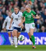 9 April 2024; Denise O'Sullivan of Republic of Ireland in action against Ella Toone of England during the UEFA Women's European Championship qualifying group A match between Republic of Ireland and England at Aviva Stadium in Dublin. Photo by Stephen McCarthy/Sportsfile