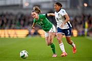 9 April 2024; Jessica Carter of England in action against Heather Payne of Republic of Ireland during the UEFA Women's European Championship qualifying group A match between Republic of Ireland and England at Aviva Stadium in Dublin. Photo by Ben McShane/Sportsfile