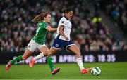 9 April 2024; Jessica Carter of England in action against Heather Payne of Republic of Ireland during the UEFA Women's European Championship qualifying group A match between Republic of Ireland and England at Aviva Stadium in Dublin. Photo by Ramsey Cardy/Sportsfile