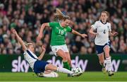 9 April 2024; Kyra Carusa of Republic of Ireland is tackled by Leah Williamson of England during the UEFA Women's European Championship qualifying group A match between Republic of Ireland and England at Aviva Stadium in Dublin. Photo by Stephen McCarthy/Sportsfile