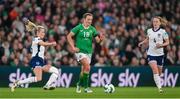9 April 2024; Kyra Carusa of Republic of Ireland in action against Leah Williamson of England during the UEFA Women's European Championship qualifying group A match between Republic of Ireland and England at Aviva Stadium in Dublin. Photo by Stephen McCarthy/Sportsfile