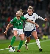 9 April 2024; Denise O'Sullivan of Republic of Ireland in action against Lauren Hemp of England during the UEFA Women's European Championship qualifying group A match between Republic of Ireland and England at Aviva Stadium in Dublin. Photo by Ramsey Cardy/Sportsfile