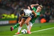 9 April 2024; Jessica Carter of England is tackled by Heather Payne of Republic of Ireland during the UEFA Women's European Championship qualifying group A match between Republic of Ireland and England at Aviva Stadium in Dublin. Photo by Ramsey Cardy/Sportsfile