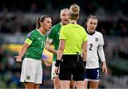 9 April 2024; Republic of Ireland captain Katie McCabe and Louise Quinn remonstrate with referee Lina Lehtovaara after she awarded a second penalty to England during the UEFA Women's European Championship qualifying group A match between Republic of Ireland and England at Aviva Stadium in Dublin. Photo by Ben McShane/Sportsfile