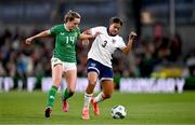 9 April 2024; Jessica Carter of England is tackled by Heather Payne of Republic of Ireland during the UEFA Women's European Championship qualifying group A match between Republic of Ireland and England at Aviva Stadium in Dublin. Photo by Ben McShane/Sportsfile