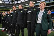 9 April 2024; Republic of Ireland head coach Eileen Gleeson, right, and her backroom staff during Amhrán na bhFiann before the UEFA Women's European Championship qualifying group A match between Republic of Ireland and England at Aviva Stadium in Dublin. Photo by Stephen McCarthy/Sportsfile