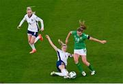 9 April 2024; Kyra Carusa of Republic of Ireland is tackled by Leah Williamson of England during the UEFA Women's European Championship qualifying group A match between Republic of Ireland and England at Aviva Stadium in Dublin. Photo by Tyler Miller/Sportsfile
