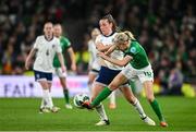 9 April 2024; Denise O'Sullivan of Republic of Ireland is tackled by Ella Toone of England during the UEFA Women's European Championship qualifying group A match between Republic of Ireland and England at Aviva Stadium in Dublin. Photo by Ramsey Cardy/Sportsfile