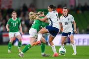 9 April 2024; Megan Connolly of Republic of Ireland is blocked by Jessica Carter of England during the UEFA Women's European Championship qualifying group A match between Republic of Ireland and England at Aviva Stadium in Dublin. Photo by Stephen McCarthy/Sportsfile