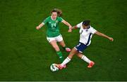 9 April 2024; Jessica Carter of England is tackled by Heather Payne of Republic of Ireland during the UEFA Women's European Championship qualifying group A match between Republic of Ireland and England at Aviva Stadium in Dublin. Photo by Tyler Miller/Sportsfile
