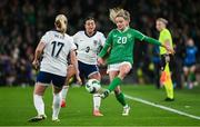 9 April 2024; Leanne Kiernan of Republic of Ireland in action against Beth Mead and Jessica Carter of England during the UEFA Women's European Championship qualifying group A match between Republic of Ireland and England at Aviva Stadium in Dublin. Photo by Ramsey Cardy/Sportsfile