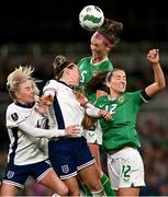 9 April 2024; Caitlin Hayes of Republic of Ireland wins a header ahead of teammate Anna Patten and England players Alex Greenwood, left, and Lucy Bronze during the UEFA Women's European Championship qualifying group A match between Republic of Ireland and England at Aviva Stadium in Dublin. Photo by Ben McShane/Sportsfile