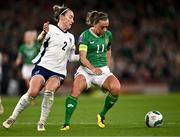 9 April 2024; Katie McCabe of Republic of Ireland in action against Lucy Bronze of England during the UEFA Women's European Championship qualifying group A match between Republic of Ireland and England at Aviva Stadium in Dublin. Photo by Ben McShane/Sportsfile