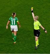 9 April 2024; Katie McCabe of Republic of Ireland is shown a yellow card by referee Lina Lehtovaara during the UEFA Women's European Championship qualifying group A match between Republic of Ireland and England at Aviva Stadium in Dublin. Photo by Tyler Miller/Sportsfile