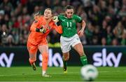 9 April 2024; Katie McCabe of Republic of Ireland is tackled by England goalkeeper Hannah Hampton during the UEFA Women's European Championship qualifying group A match between Republic of Ireland and England at Aviva Stadium in Dublin. Photo by Stephen McCarthy/Sportsfile