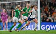 9 April 2024; Georgia Stanway of England in action against Denise O'Sullivan and Megan Connolly of Republic of Ireland during the UEFA Women's European Championship qualifying group A match between Republic of Ireland and England at Aviva Stadium in Dublin. Photo by Stephen McCarthy/Sportsfile