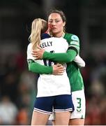 9 April 2024; Megan Campbell of Republic of Ireland and Chloe Kelly of England embrace after the UEFA Women's European Championship qualifying group A match between Republic of Ireland and England at Aviva Stadium in Dublin. Photo by Ben McShane/Sportsfile