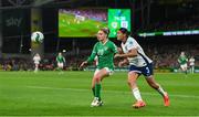 9 April 2024; Leanne Kiernan of Republic of Ireland in action against Jessica Carter of England during the UEFA Women's European Championship qualifying group A match between Republic of Ireland and England at Aviva Stadium in Dublin. Photo by Stephen McCarthy/Sportsfile