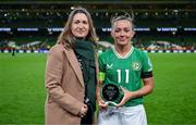 9 April 2024; Sky Ireland chief operating officer Orlaith Ryan presents Katie McCabe of Republic of Ireland with the Sky Player of the Match award after the UEFA Women's European Championship qualifying group A match between Republic of Ireland and England at Aviva Stadium in Dublin. Photo by Stephen McCarthy/Sportsfile