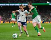 9 April 2024; Lucy Quinn of Republic of Ireland in action against Keira Walsh of England during the UEFA Women's European Championship qualifying group A match between Republic of Ireland and England at Aviva Stadium in Dublin. Photo by Stephen McCarthy/Sportsfile
