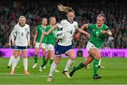 9 April 2024; Keira Walsh of England in action against Caitlin Hayes of Republic of Ireland during the UEFA Women's European Championship qualifying group A match between Republic of Ireland and England at Aviva Stadium in Dublin. Photo by Stephen McCarthy/Sportsfile