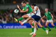 9 April 2024; Jessica Carter of England clears under pressure from Katie McCabe of Republic of Ireland during the UEFA Women's European Championship qualifying group A match between Republic of Ireland and England at Aviva Stadium in Dublin. Photo by Stephen McCarthy/Sportsfile