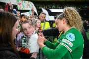 9 April 2024; Leanne Kiernan of Republic of Ireland signs an autograph for a supporter after the UEFA Women's European Championship qualifying group A match between Republic of Ireland and England at Aviva Stadium in Dublin. Photo by Stephen McCarthy/Sportsfile