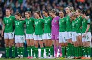 9 April 2024; The Republic of Ireland team wear black armbands and pause for a moment's silence in memory of the late Kelly Healy, wife of Republic of Ireland assistant coach Colin Healy the UEFA Women's European Championship qualifying group A match between Republic of Ireland and England at Aviva Stadium in Dublin. Photo by Stephen McCarthy/Sportsfile