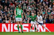 9 April 2024; Denise O'Sullivan of Republic of Ireland in action against Keira Walsh of England during the UEFA Women's European Championship qualifying group A match between Republic of Ireland and England at Aviva Stadium in Dublin. Photo by Stephen McCarthy/Sportsfile