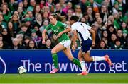 9 April 2024; Heather Payne of Republic of Ireland in action against Jessica Carter of Englandof England during the UEFA Women's European Championship qualifying group A match between Republic of Ireland and England at Aviva Stadium in Dublin. Photo by Stephen McCarthy/Sportsfile