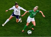 9 April 2024; Denise O'Sullivan of Republic of Ireland in action against Lucy Bronze of England during the UEFA Women's European Championship qualifying group A match between Republic of Ireland and England at Aviva Stadium in Dublin. Photo by Tyler Miller/Sportsfile