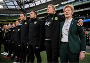 9 April 2024; Republic of Ireland head coach Eileen Gleeson with coaches, from right, assistant coach Emma Byrne, assistant coach Stephen Rice, assistant coach Rhys Carr and performance coach Ivi Casagrande during the playing of the National Anthem before the UEFA Women's European Championship qualifying group A match between Republic of Ireland and England at Aviva Stadium in Dublin. Photo by Stephen McCarthy/Sportsfile