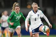 9 April 2024; Alex Greenwood of England and Leanne Kiernan of Republic of Ireland during the UEFA Women's European Championship qualifying group A match between Republic of Ireland and England at Aviva Stadium in Dublin. Photo by Stephen McCarthy/Sportsfile