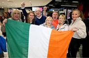 10 April 2024; Republic of Ireland's Ellen Dolan celebrates with family on the team's arrival at Dublin Airport from Croatia where the Republic of Ireland Women's U19 squad qualified for July's UEFA Women's U19 European Championships to be held in Lithuania. Photo by Stephen McCarthy/Sportsfile