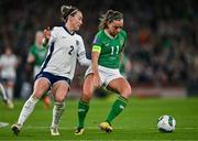 9 April 2024; Katie McCabe of Republic of Ireland and Lucy Bronze of England during the UEFA Women's European Championship qualifying group A match between Republic of Ireland and England at Aviva Stadium in Dublin. Photo by Ben McShane/Sportsfile