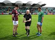 6 April 2024; Referee Liam Devenney performs the coin toss in the company of team captains Sean Kelly of Galway, left, and Eoin Walsh of London, both from Moycullen in Galway, before the Connacht GAA Football Senior Championship quarter-final match between London and Galway at McGovern Park in Ruislip, England. Photo by Brendan Moran/Sportsfile Photo by Brendan Moran/Sportsfile