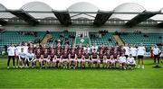 6 April 2024; Galway manager Pádraic Joyce, right, watches as the Galway team sit for a team photograph before the Connacht GAA Football Senior Championship quarter-final match between London and Galway at McGovern Park in Ruislip, England. Photo by Brendan Moran/Sportsfile