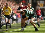 7 April 2024; Seán O’Brien of Munster is tackled by James Ramm and Ollie Sleightholme of Northampton Saints during the Investec Champions Cup Round of 16 match between Northampton Saints and Munster at cinch Stadium at Franklin’s Gardens in Northampton, England. Photo by Brendan Moran/Sportsfile