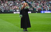 9 April 2024; Singer Lisa Lambe performs Amhrán na bhFiann before the UEFA Women's European Championship qualifying group A match between Republic of Ireland and England at Aviva Stadium in Dublin. Photo by Ramsey Cardy/Sportsfile