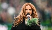 9 April 2024; Singer Lisa Lambe performs Amhrán na bhFiann before the UEFA Women's European Championship qualifying group A match between Republic of Ireland and England at Aviva Stadium in Dublin. Photo by Ramsey Cardy/Sportsfile