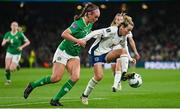 9 April 2024; Lauren Hemp of England in action against Caitlin Hayes of Republic of Ireland during the UEFA Women's European Championship qualifying group A match between Republic of Ireland and England at Aviva Stadium in Dublin. Photo by Ramsey Cardy/Sportsfile
