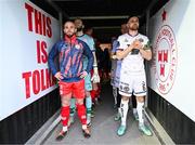 12 April 2024; Shelbourne captain Mark Coyle, Bohemians captain Jordan Flores and their team-mates await the officals before the SSE Airtricity Men's Premier Division match between Shelbourne and Bohemians at Tolka Park in Dublin. Photo by Stephen McCarthy/Sportsfile