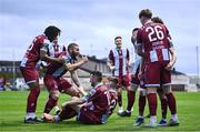 12 April 2024; Warren Davis of Drogheda United, hidden, celebrates with teammates after scoring their side's first goal during the SSE Airtricity Men's Premier Division match between Drogheda United and Derry City at Weavers Park in Drogheda, Louth. Photo by Ramsey Cardy/Sportsfile