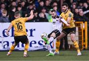12 April 2024; Robbie Mahon of Dundalk in action against Luke Turner, right, and Aaron Bolger of St Patrick's Athletic during the SSE Airtricity Men's Premier Division match between Dundalk and St Patrick's Athletic at Oriel Park in Dundalk, Louth. Photo by Piaras Ó Mídheach/Sportsfile